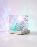 Borelle Aurora Cube proyectando ondas de luz aurora